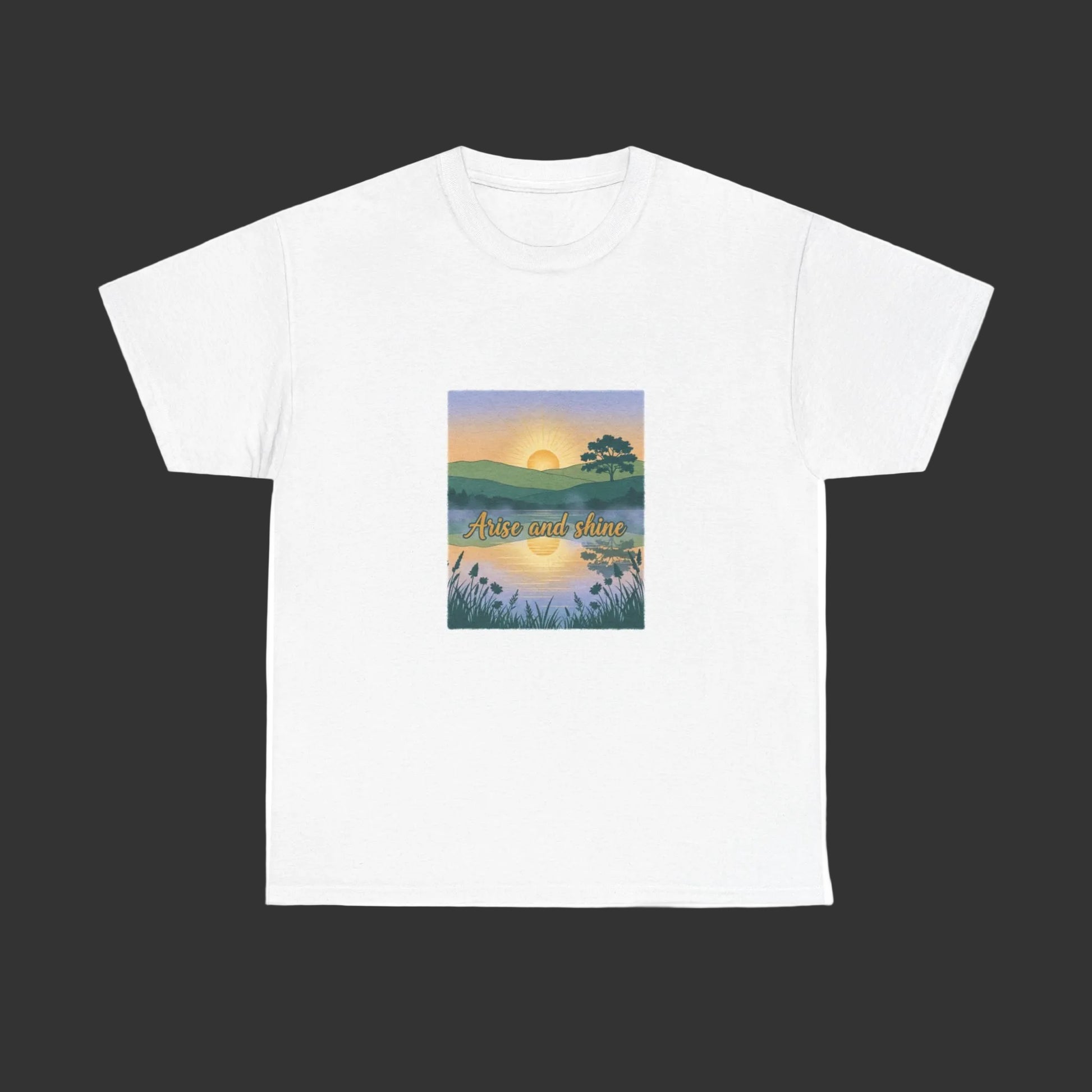 White t-shirt with a graphic of a sunset over a field and 'Arise and Shine’ text on a white background.