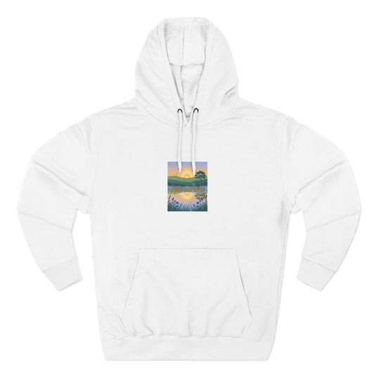 White hoodie with a small graphic on the chest against a white background-Arise and Shine.