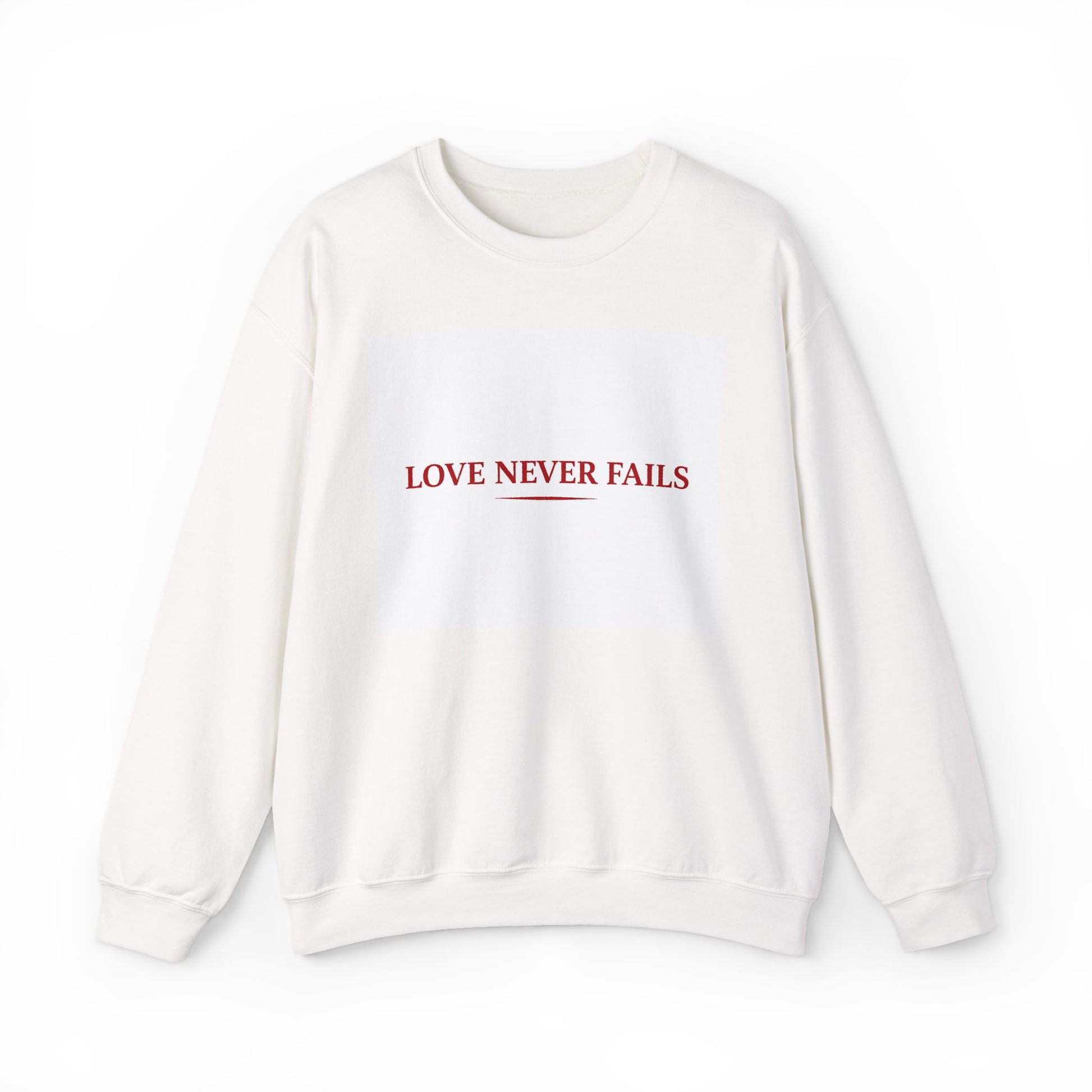 White sweatshirt with 'LOVE NEVER FAILS' text in red on a white background